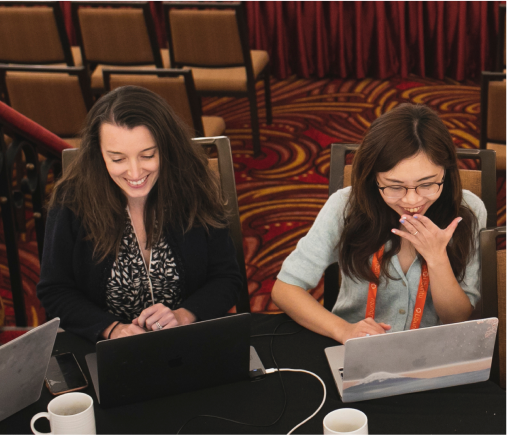 Employees working together on different laptops